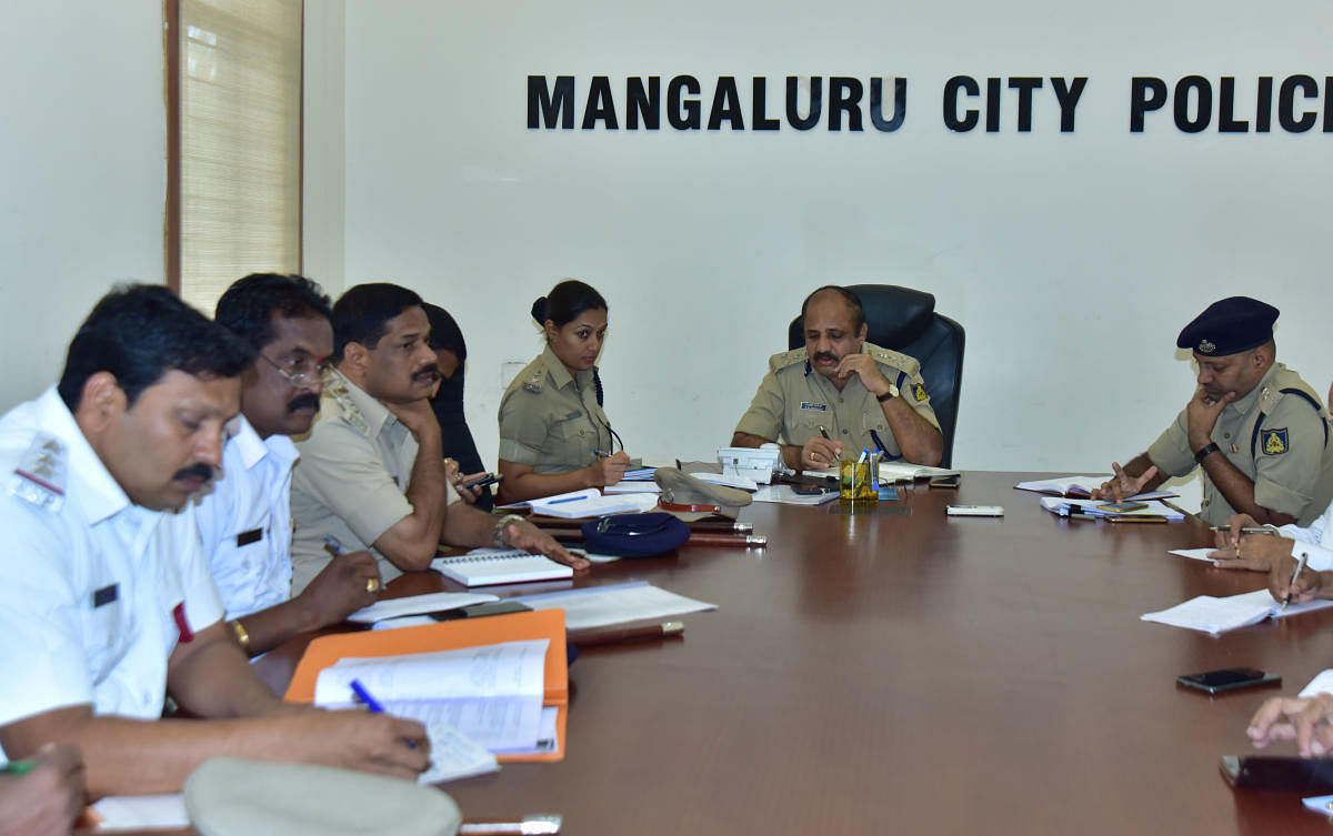 Mangaluru Commissioner of Police T R Suresh at the phone-in-programme organised at his office.