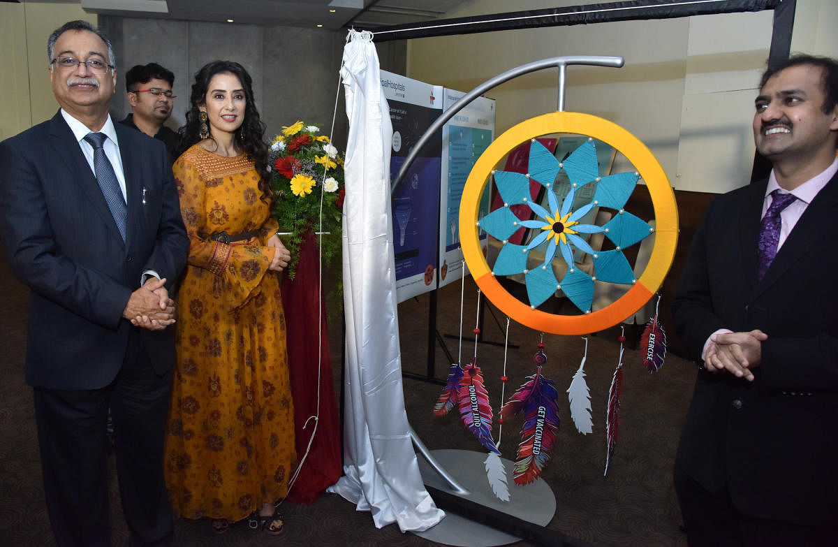 Manisha Koirala, bollywood actress and cancer survivor, during the World Cancer Day programme at the Manipal Hospital on Monday. (right) Dr H Sudarshan Ballal, Chairman of Manipal Hospitals is also seen. DH photo/Janardhan B K