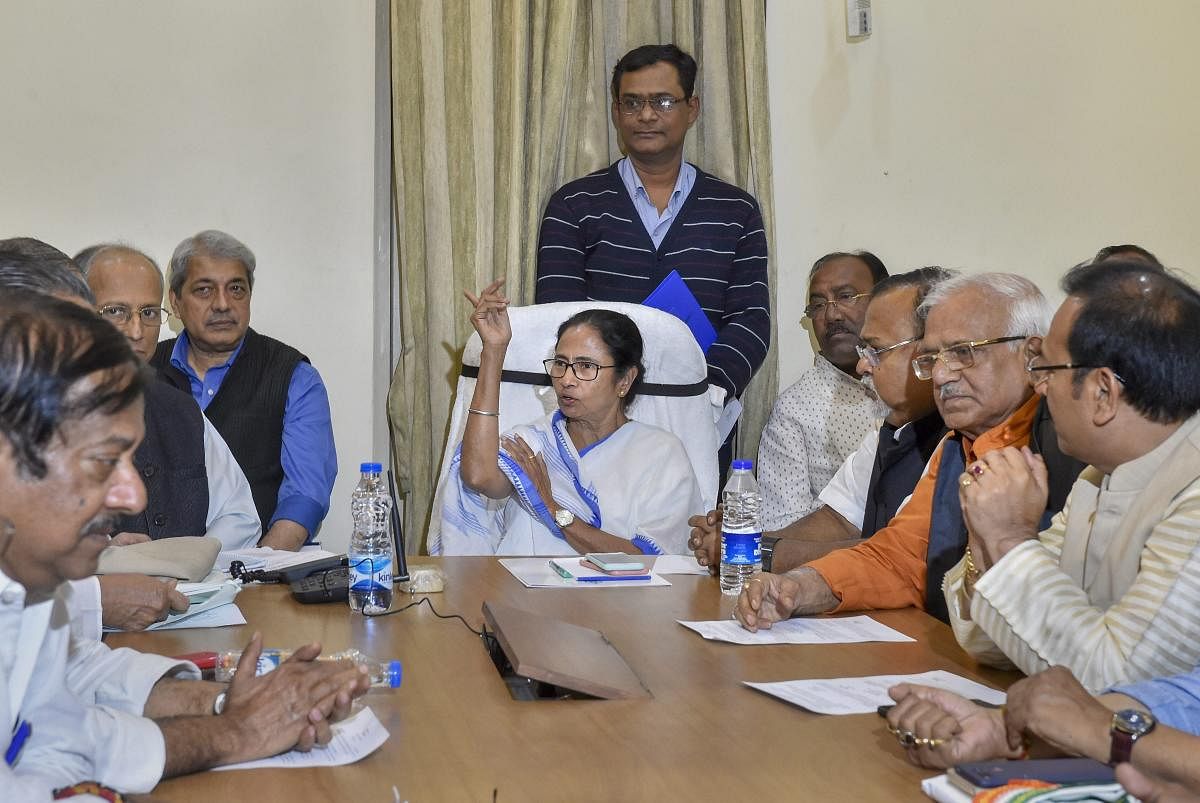 West Bengal Chief Minister Mamata Banerjee chairs a cabinet meeting at the protest site during a sit-in over the CBI's attempt to question the Kolkata Police commissioner in connection with chit fund scams, in Kolkata. PTI