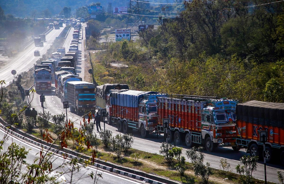 Stranded trucks wait for the opening of the Jammu-Srinagar national highway. PTI file photo
