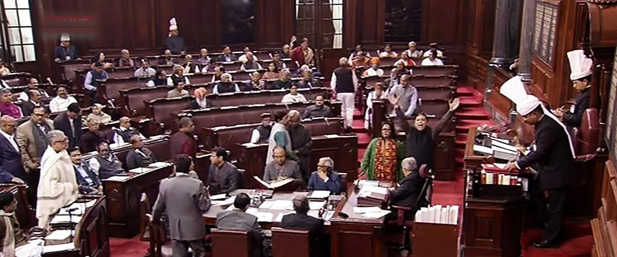 Opposition members protest in the Rajya Sabha during the Budget Session of Parliament, in New Delhi, Tuesday, Feb. 05, 2019. (RSTV grab via PTI)