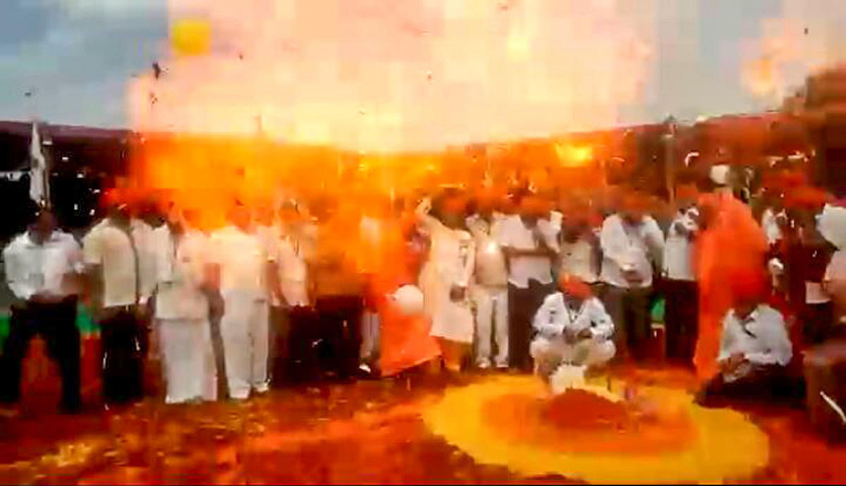 Flames erupt after balloons exploded at the inauguration of the wrestling tournament organised as part of Suttur Jathra in Nanjangud taluk, Mysuru district, on Tuesday. (Inset) Suttur seer sustained injuries in the incident. dh photo