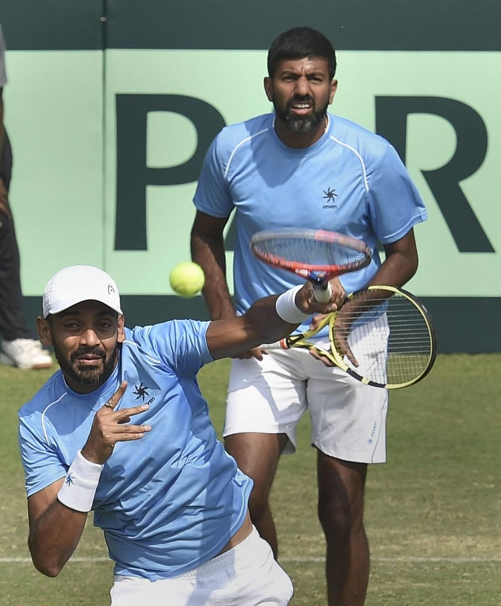 India's Divij Sharan (front) and Rohan Bopanna won their doubles rubber but it still wasn't enough as Italy wrapped a convincing 3-1 win in Kolkata on Saturday. PTI