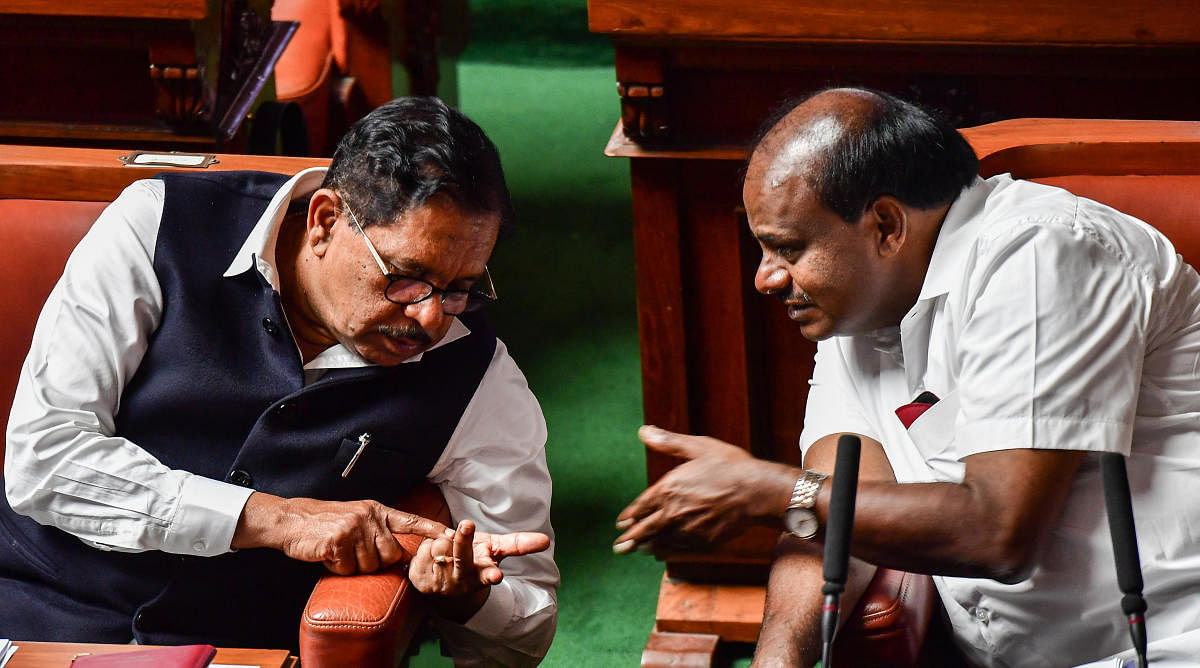 Every member counts: Deputy Chief Minister G Parameshwara appears to be giving a count of the Congress legislators who gave the legislature session a miss to Chief Minister H D Kumaraswamy in Bengaluru on Wednesday. Ten coalition legislators failed to tur