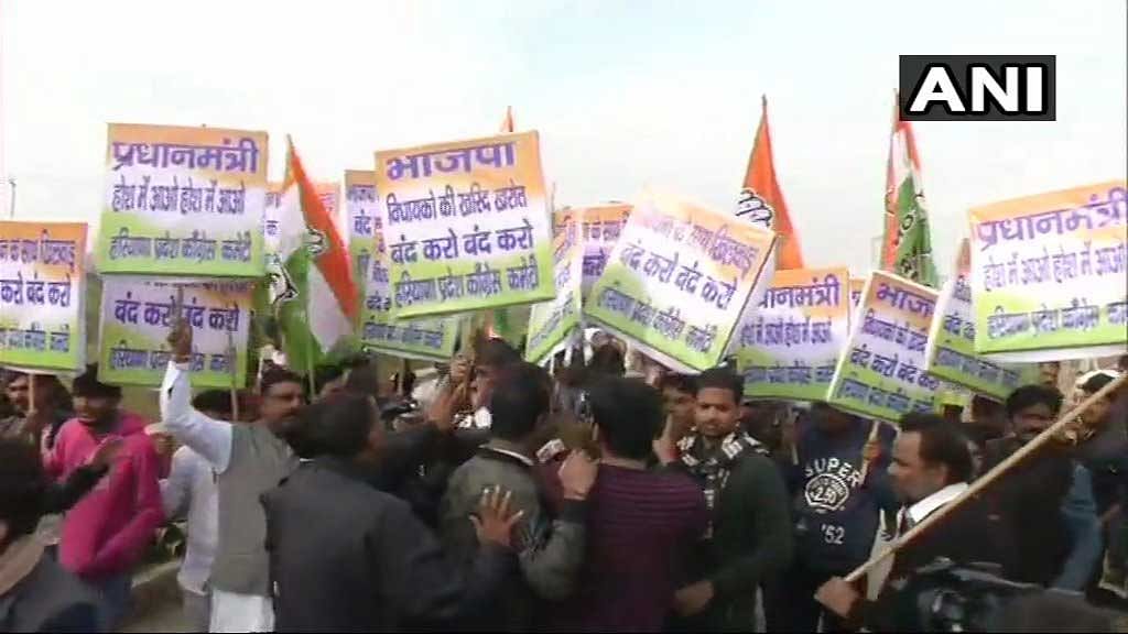 Amidst speculation that the BJP is indulging in Operation Lotus, Congress workers staged a protest infront of luxury hotel near Gurugram where nearly 100 BJP MLA are staying for the past two days on Wednesday morning. ANI photo