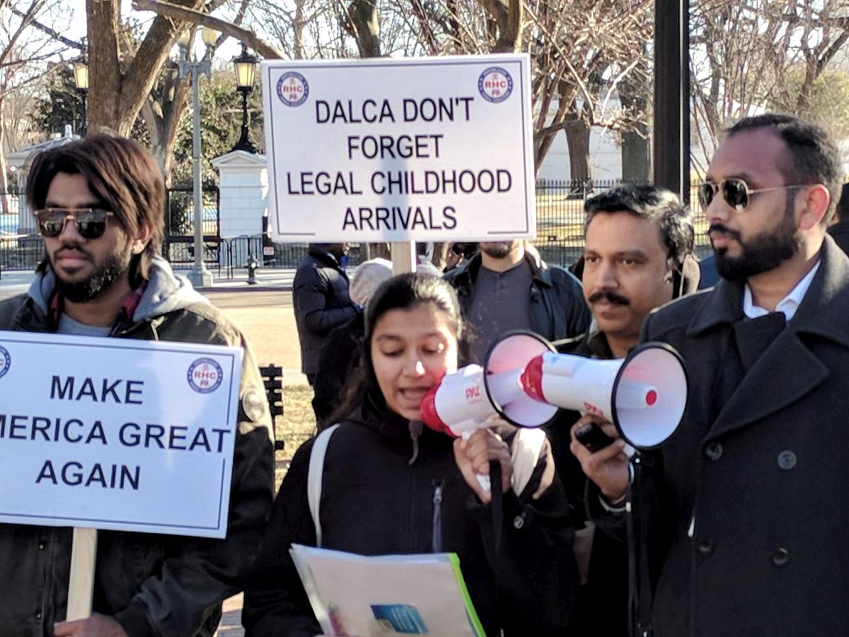 Hundred highly-skilled Indian workers hold a rally to end the per-country limit on legal permanent residency so as to eliminate the massive Green Card backlog, in front of the White House in Washington, D.C. PTI Photo