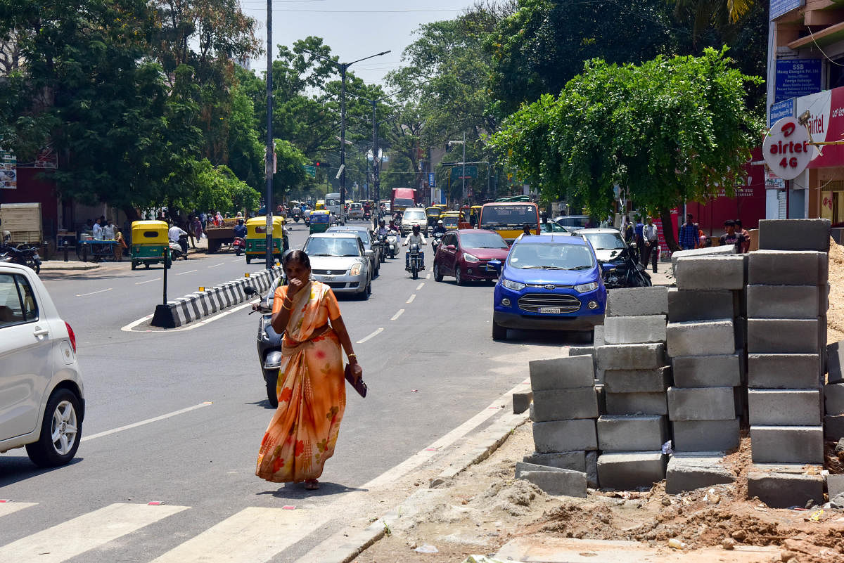 Footpath encroachments pose a risk to pedestrians by forcing them to walk on the road.