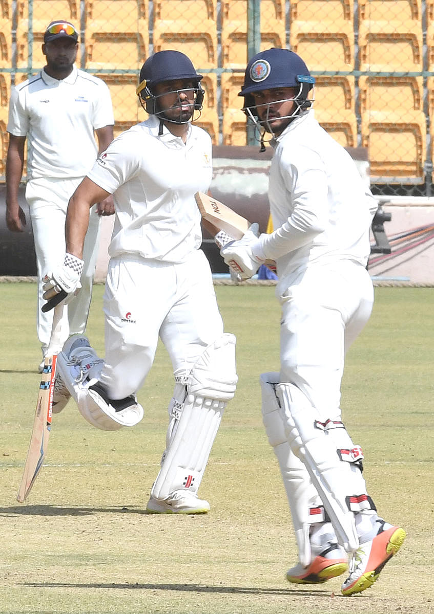 DOUBLE TROUBLE Karun Nair (left) and Manish Pandey struck unbeaten half-centuries to guide Karnataka to a six-wicket over Rajasthan in their Ranji Tophy quarterfinal at the M Chinnaswamy Sadium in Bengaluru on Friday. DH Photo/ Srikanta Sharma R
