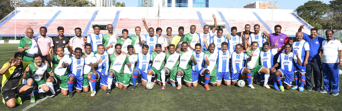 Former ITI and HAL players before their clash at the Bangalore Football Stadium on Saturday. DH photo