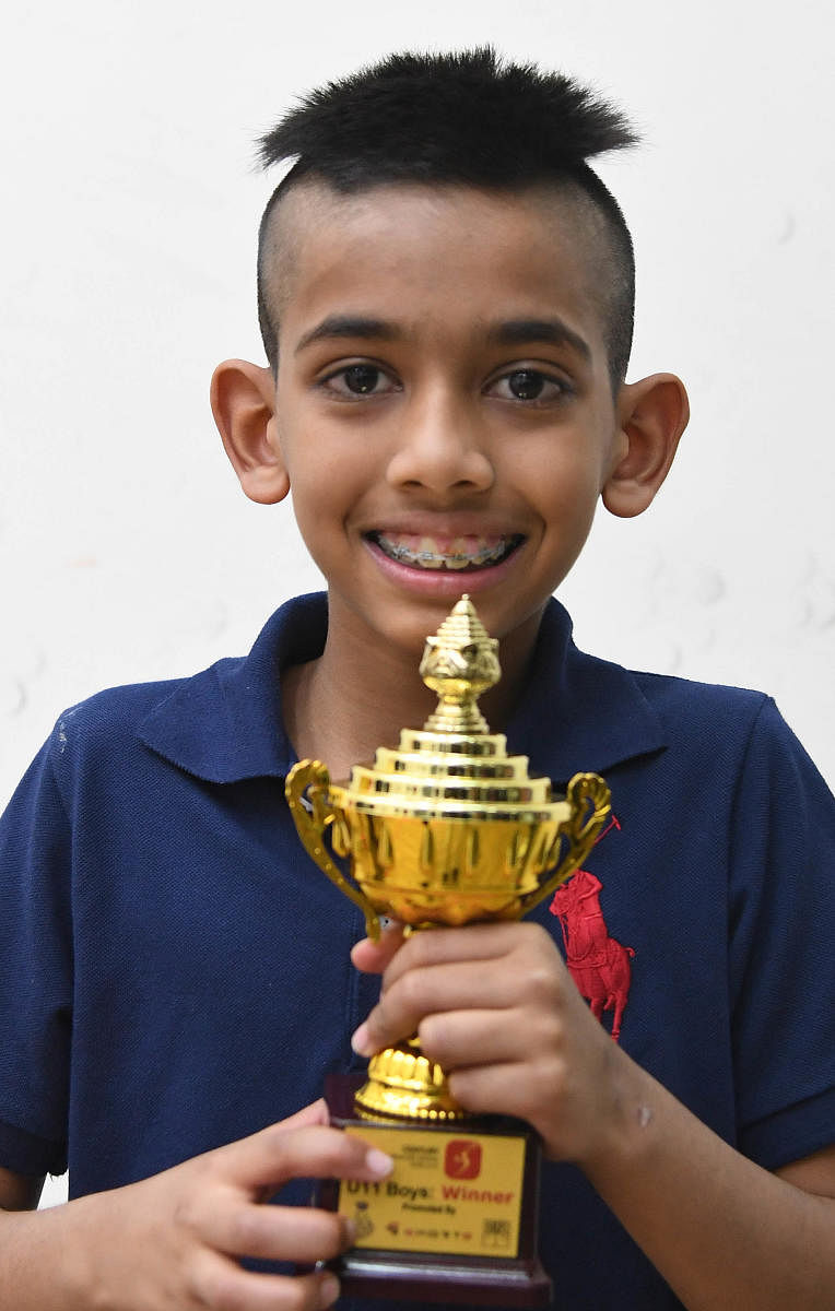 Rahul Sanjay Balakrishnan is all smiles after winning the under-11 title in the just-concluded 5Sports Century Bangalore Open squash tournament. DH PHOTO/ SRIKANTA SHARMA R 