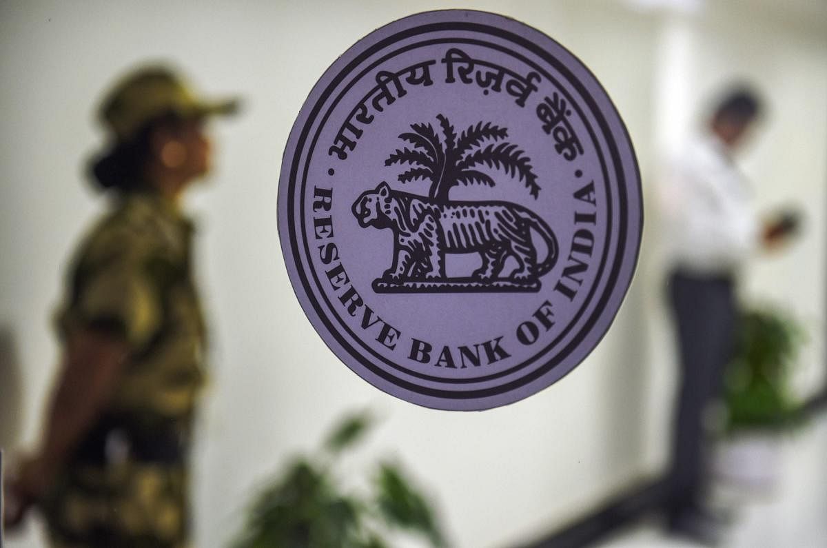 A security woman guards at the RBI headquarters during bi-monthly monetary policy review meeting, in Mumbai. PTI