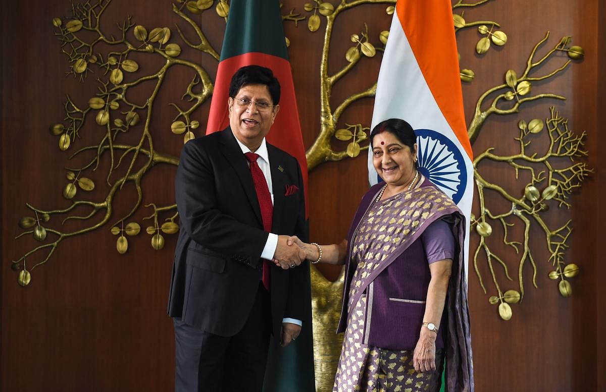 Foreign Minister Sushma Swaraj (R) shakes hands with her Bangladesh counterpart A K Abdul Momen (L) before a meeting at the Ministry of External Affairs in New Delhi on Friday. AFP