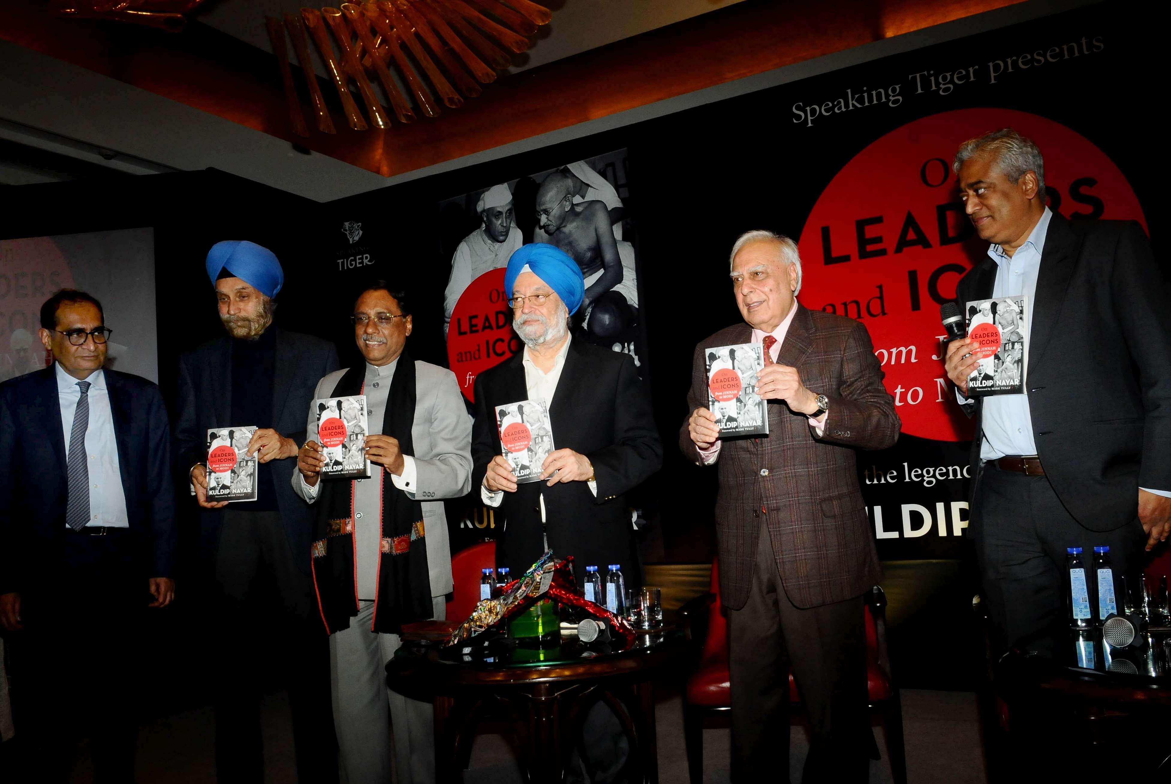 Kuldip Nayar’s last book “On Leaders and Icons: From Jinnah to Modi” released by Rajeev Nayar, Kuldip Nayar's younger son (L), Navtej Singh Sarna (2L), JDU leader Pavan K. Varma (3L), Union Minister of State with Independent Charge in the Ministry of Housing and Urban Affairs, Hardeep Singh Puri (C), Congress leader Kapil Sibal (2R) and journalist Rajdeep Sardesai (R) at Oberoi Hotel in New Delhi, India, on Friday, February 8, 2019. DH Photo