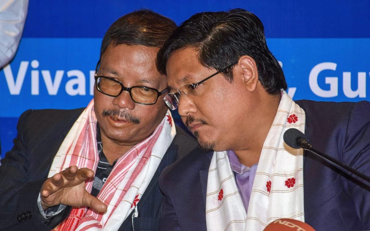Meghalaya Chief Minister Conrad K Sangma and former Meghalaya chief minister Donkupar Roy attend the N E Region's Political Parties Convention on Citizenship Amendment Bill, in Guwahati, Tuesday, Jan. 29, 2019. (PTI Photo)