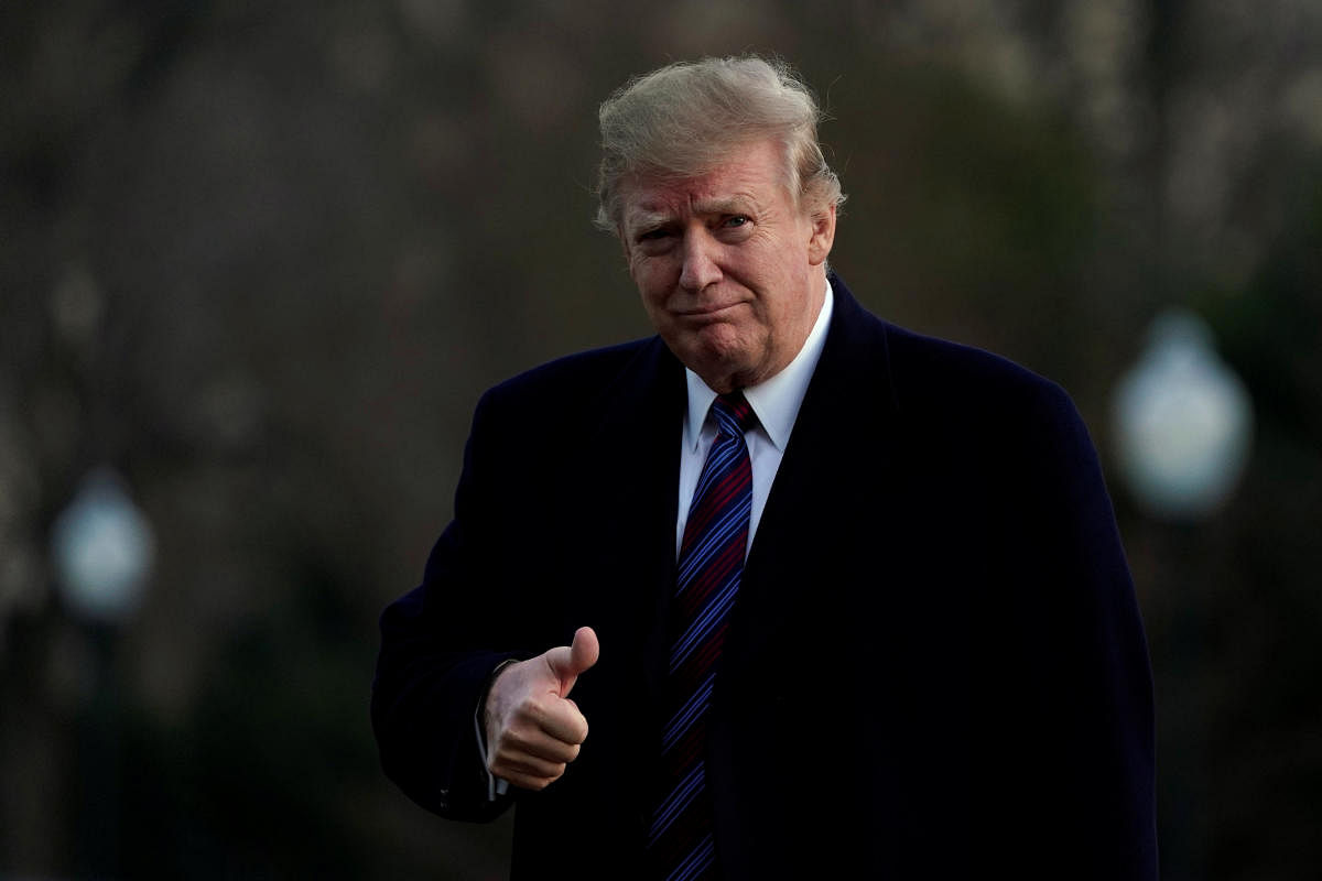 U.S. President Donald Trump thumbs up as he returns to the White House in Washington, U.S., after an annual physical test at the Walter Reed National Military Medical Center in Bethesda, Maryland, February 8, 2019. REUTERS