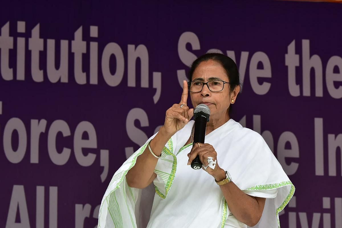 West Bengal Chief Minister and All India Trinamool Congress leader Mamata Banerjee speaks during a protest against the recent raids by India's Central Bureau of Investigation (CBI), in Kolkata on February 5, 2019. (Photo by STR / AFP)