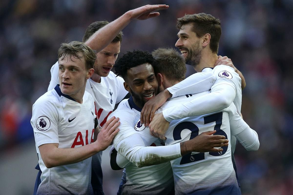 Tottenham Hotspur’s Christian Eriksen (second from right) celebrates with team-mates after scoring against Leicester City in London on Sunday. AFP