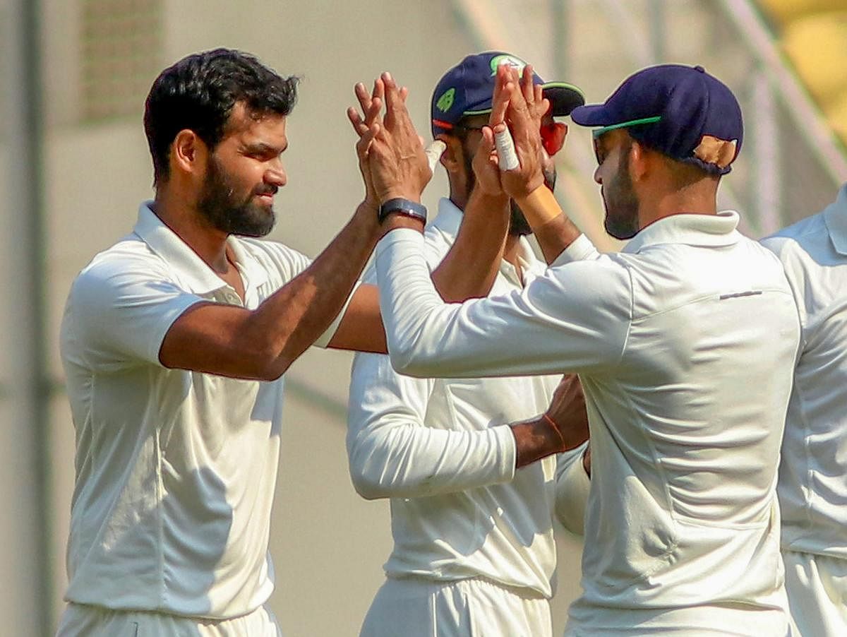 KEY MAN: The in-form left-arm spinner Aditya Sarwate (left) of Vidarbha will be a major threat to Rest of India in the Irani Cup. PTI File Photo