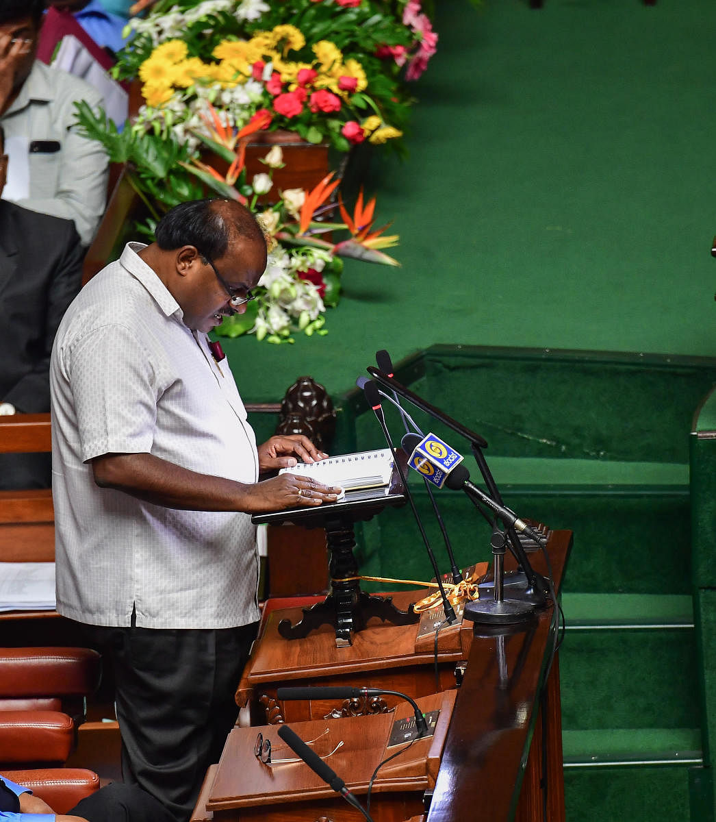 Kumaraswamy reads out the budget speech.
