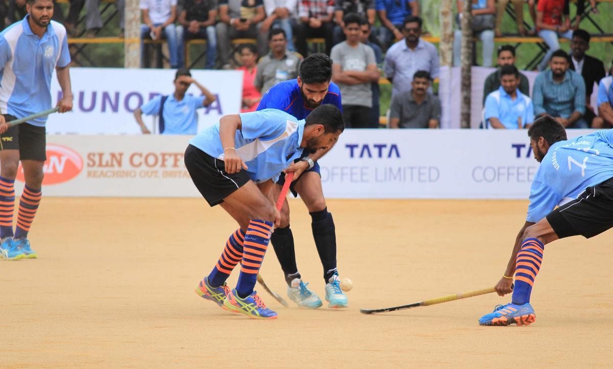 A file photograph of an exhibition match between Indian Olympian and Coorg International teams.