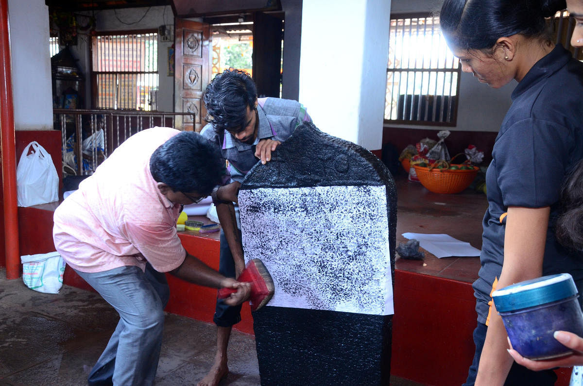 Experts' team collect imprint of an inscription found at Sri Veeranarayana Temple in Kulashekar.