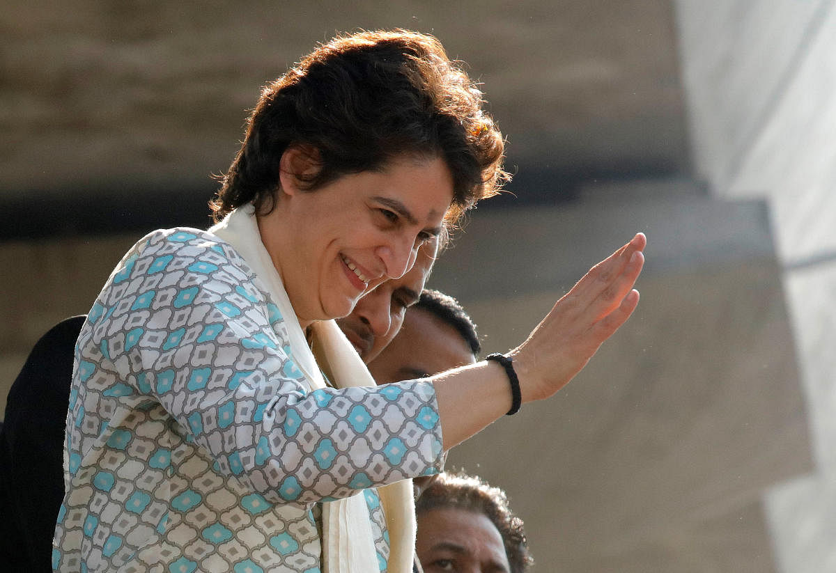 Congress general secretary Priyanka Gandhi Vadra waves to her supporters during a roadshow in Lucknow on Monday. REUTERS