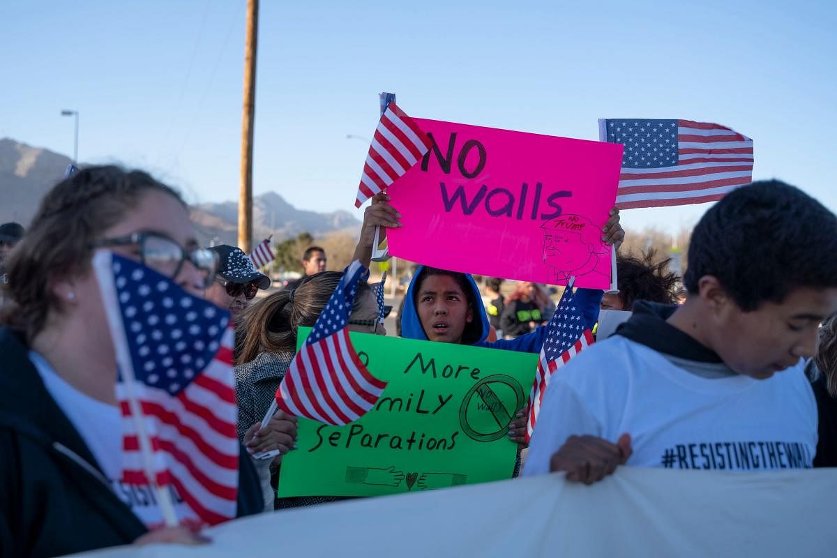Anti-Trump marchers gather for the "March for Truth" in El Paso, Texas, on February 11, 2019. - The march took place at the same time as US President Donald Trump pushed his politically explosive crusade to wall off the Mexican border at a rally in El Pas
