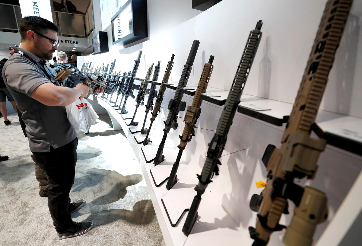 An attendee looks over a Sig Sauer semiautomatic rifle during the SHOT (Shooting, Hunting, Outdoor Trade) Show in Las Vegas. Reuters file photo for representation.