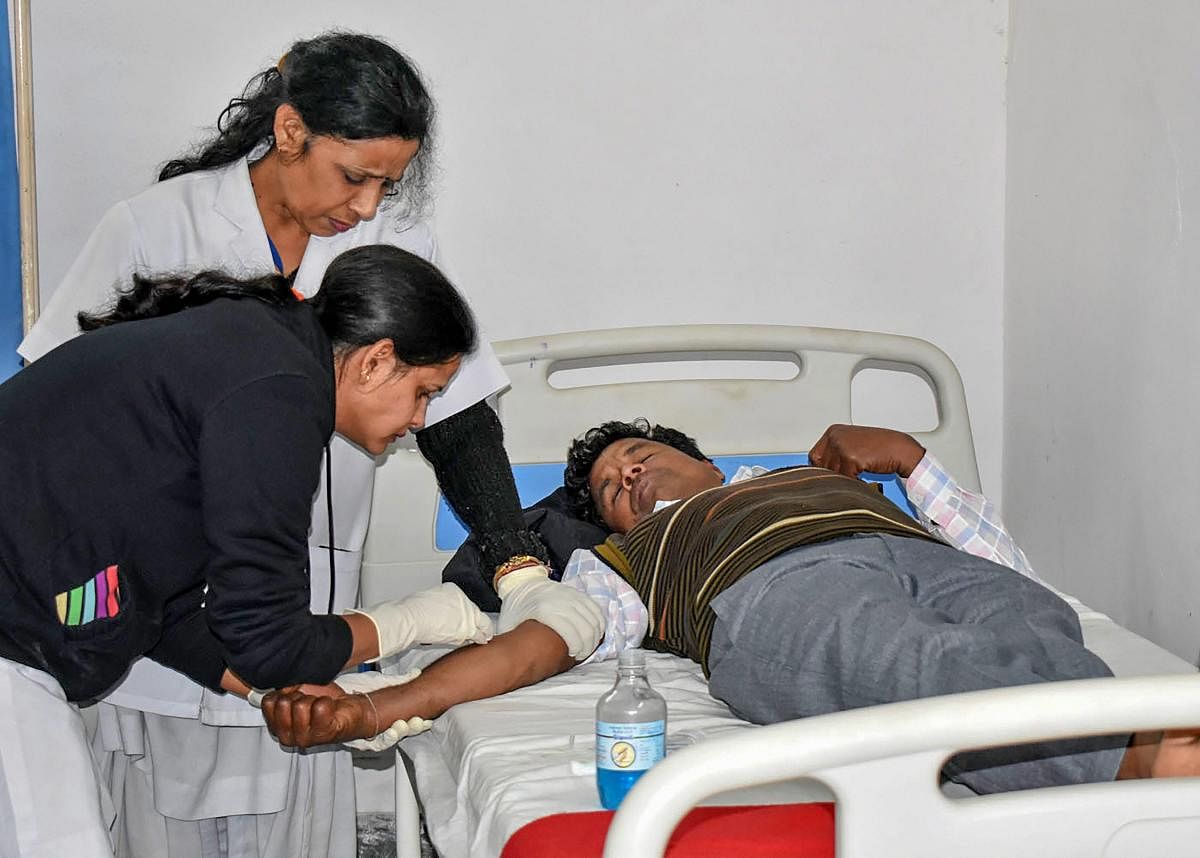 Victims undergo treatment on being poisoned after consuming a spurious liquor, at a hospital in Haridwar, Saturday, Feb 9, 2019. Thirty-four people died in two adjoining districts allegedly after drinking spurious liquor at a village in Uttarakhand's Hari
