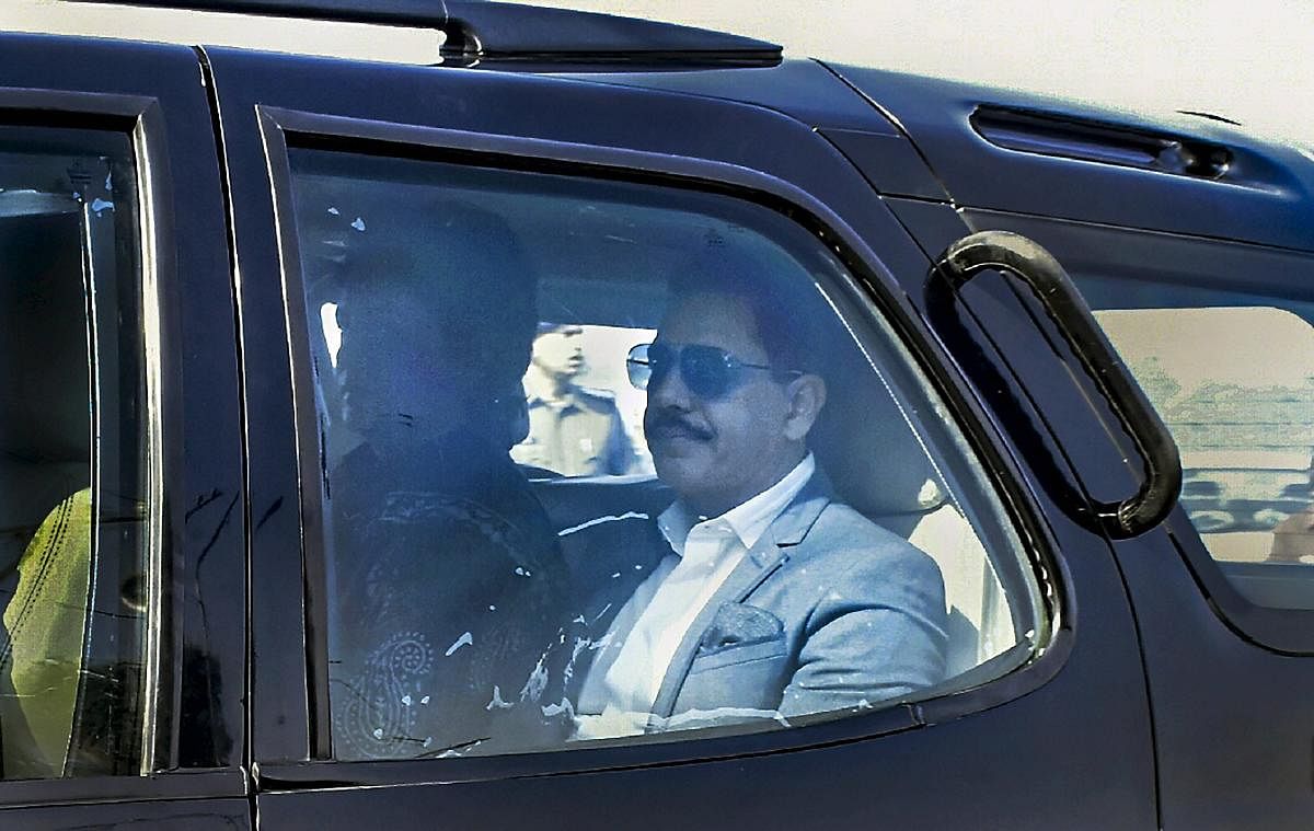 Businessman Robert Vadra leaves to appear before the Enforcement Directorate (ED) officials, in connection with the alleged Bikaner land scam, in Jaipur, Tuesday, Feb. 12, 2019. Congress General Secretary Priyanka Gandhi Vadra is also seen. (PTI Photo)