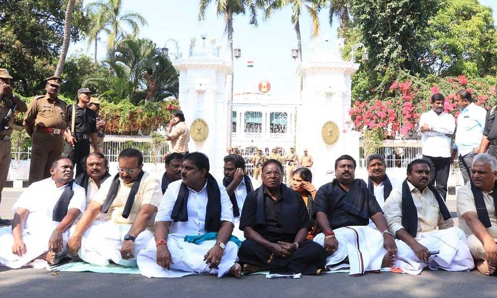 Puducherry Chief Minister V Narayanaswamy, his colleagues and party members sitting on a dharna outside the LG’s official residence-cum-office. Photo: Facebook/CMPuducherry/