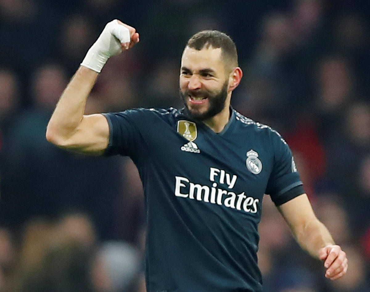 Real Madrid's Karim Benzema celebrates after scoring against Ajax Amsterdam in the first leg of the last-16 tie on Wednesday. REUTERS