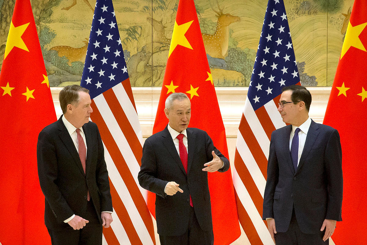 U.S. Trade Representative Robert Lighthizer, Chinese Vice Premier and lead trade negotiator Liu He, and U.S. Treasury Secretary Steven Mnuchin talk before the opening session of trade negotiations at the Diaoyutai State Guesthouse in Beijing. Reuters