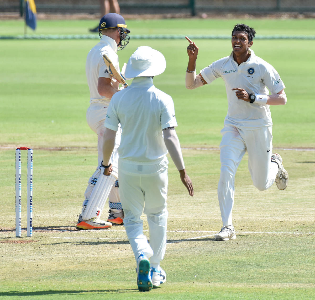 SEE YOU LATER, MATE! Navdeep Saini of India A (right) celebrates after castling Sam Billings of England Lions on Thursday. DH PHOTO/ SAVITHA B R