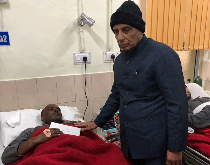 The home minister, who arrived in Srinagar following the worst terror attack on security forces in the state in the past three decades, also visited the injured jawans undergoing treatment at a hospital. (Image: ANI/Twitter)