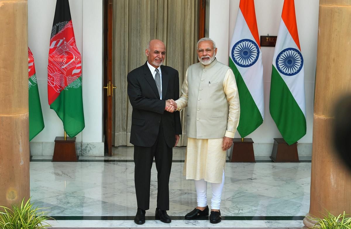 Prime Minister Narendra Modi and Afghanistan President Ashraf Ghani ahead of a meeting at Hyderabad House in New Delhi, Wednesday. (PTI Photo)