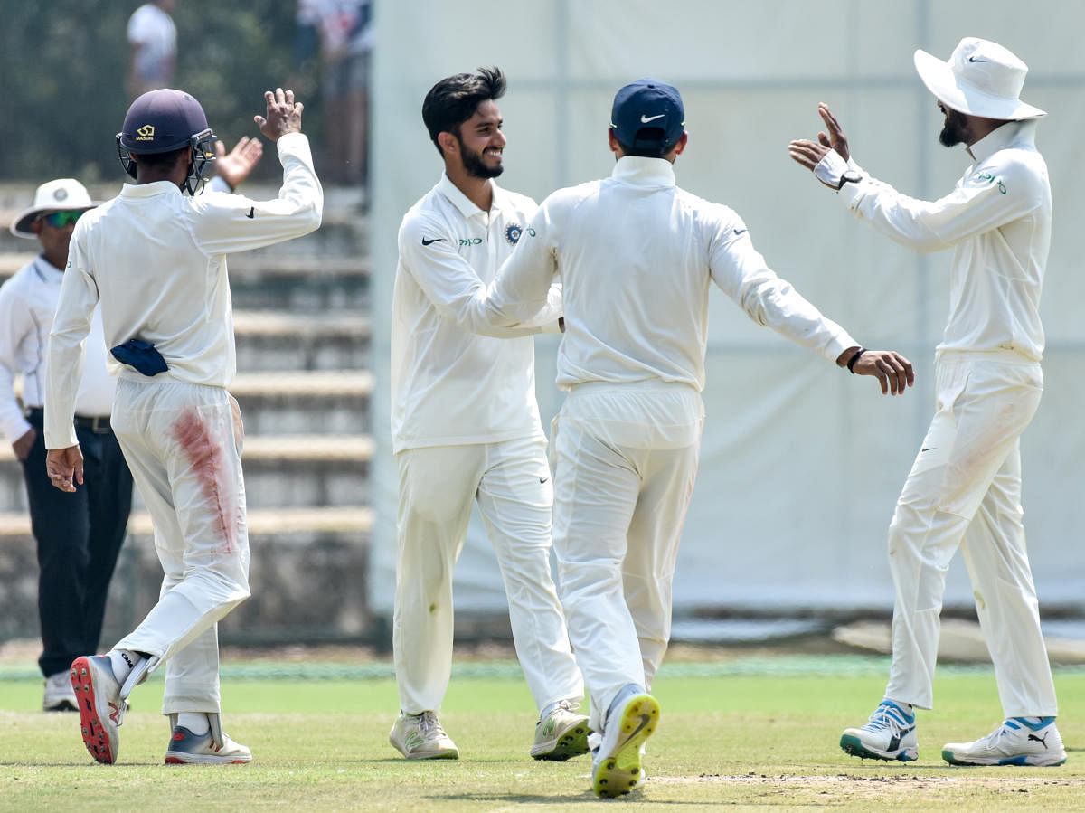 FINE SHOW: Mayank Markande of India 'A' celebrates with team-mates after dismissing an England Lions' batsman on the penultimate day of the second four-day game in Mysuru on Friday. DH PHOTO/SAVITHA BR 