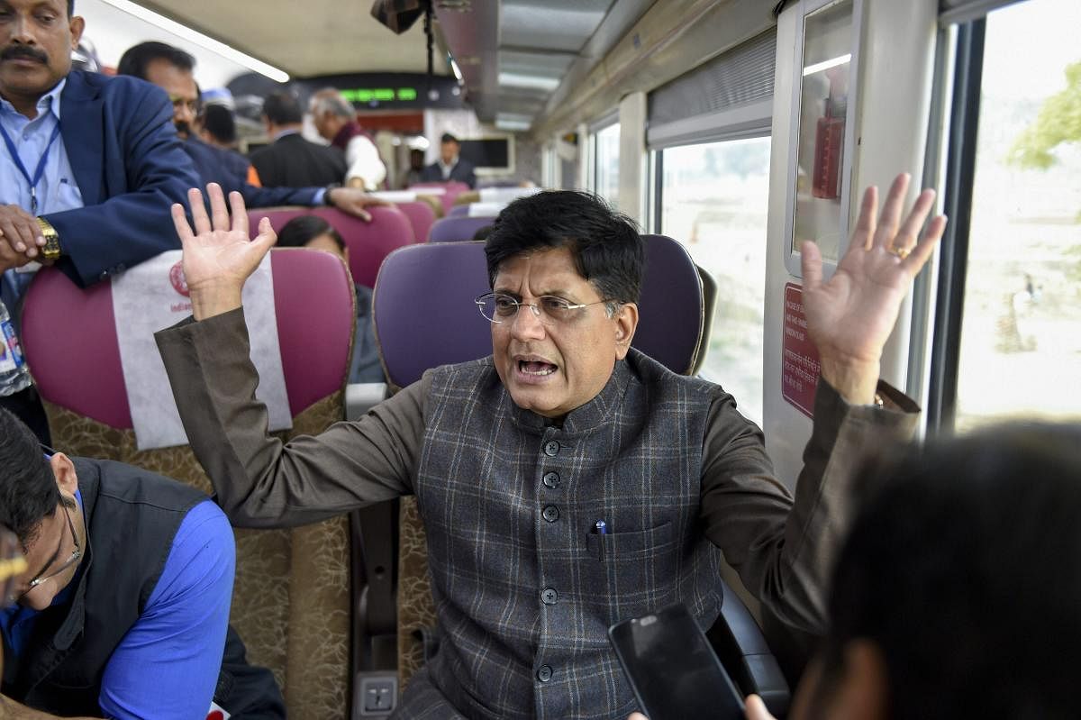 Railway Minister Piyush Goyal interacts with the media while travelling by the India's first semi-high speed train, the Vande Bharat Express, after it was flagged off by Prime Minister Narendra Modi from New Delhi Railway Station on Friday. (PTI Photo)