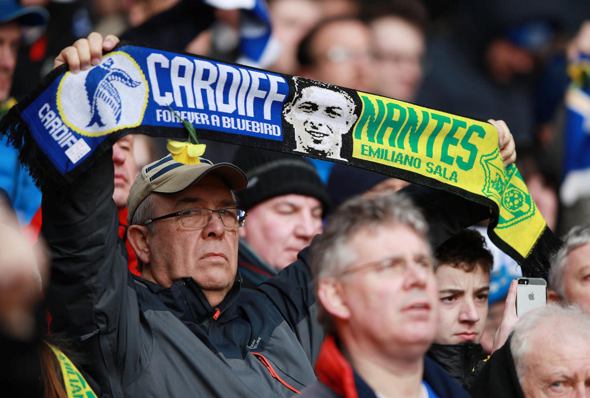 GOODBYE: A fan holds a scarf in remembrance of Emiliano Sala before the match between Southampton and Cardiff City on Saturday. REUTERS