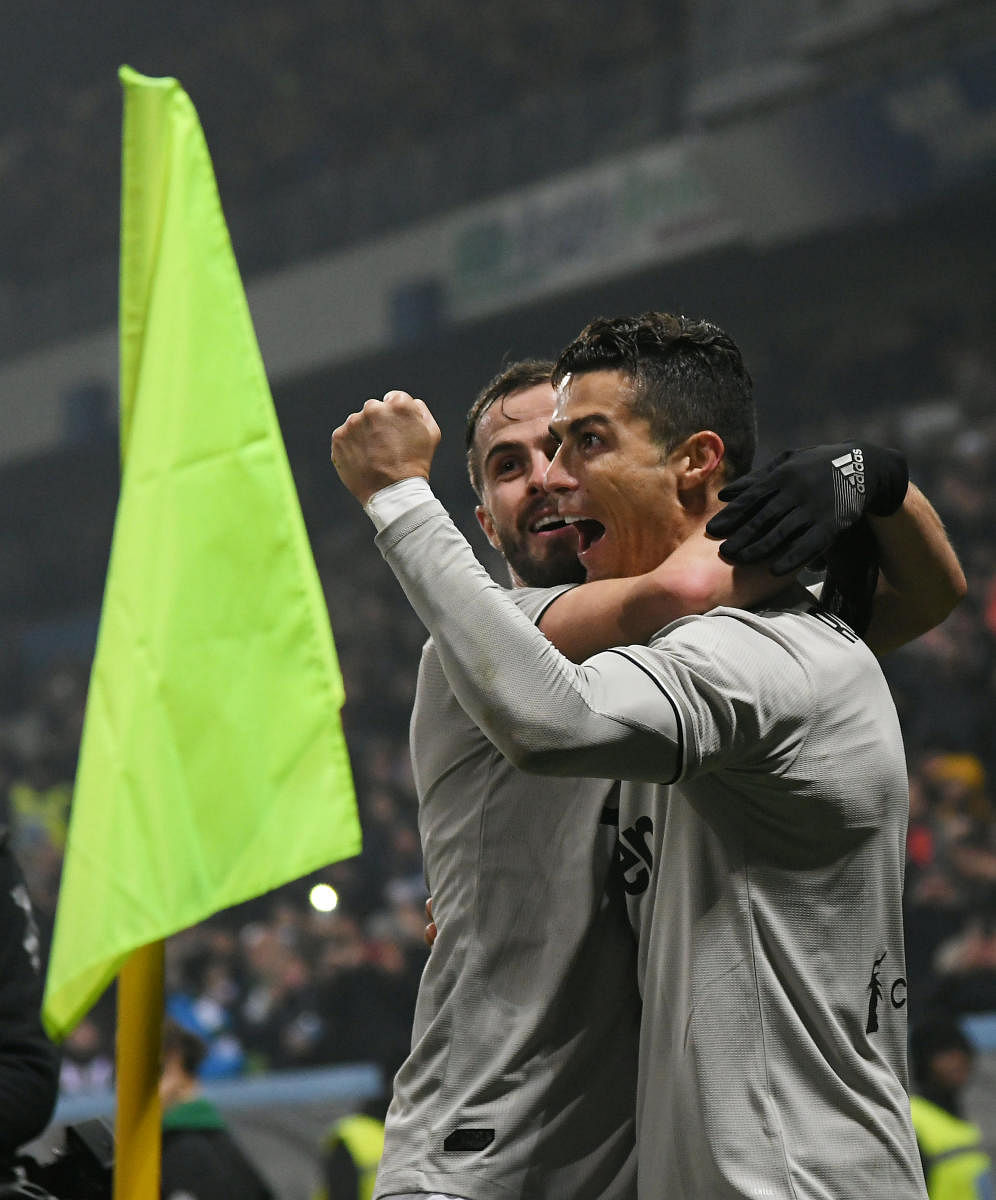 Juventus' Cristiano Ronaldo (right) celebrates with Federico Bernardeschi after scoring against Sassuolo on Sunday. REUTERS