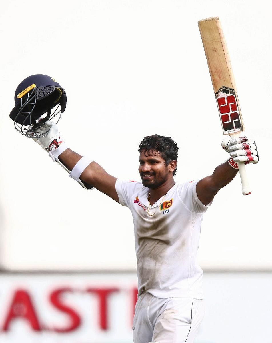 Sri Lanka's Kusal Perera celebrates after powering his side to a sensational win over South Africa on Saturday. AFP