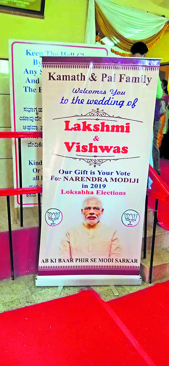 The banner seeking vote for Prime Minister Narendra Modi put up at the marriage of Lakshmi and Vishwas in Mangaluru.