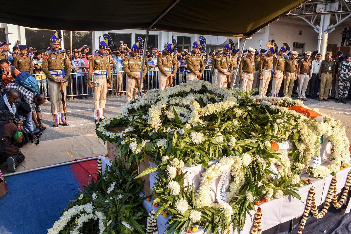 Central Reserve Police Force personnel pay Guard of Honour to slain CRPF Jawan Bablu Santra, who lost his life in the Pulwama terror attack, at Airport, in Kolkata, Saturday, Feb. 16, 2019. (PTI Photo)