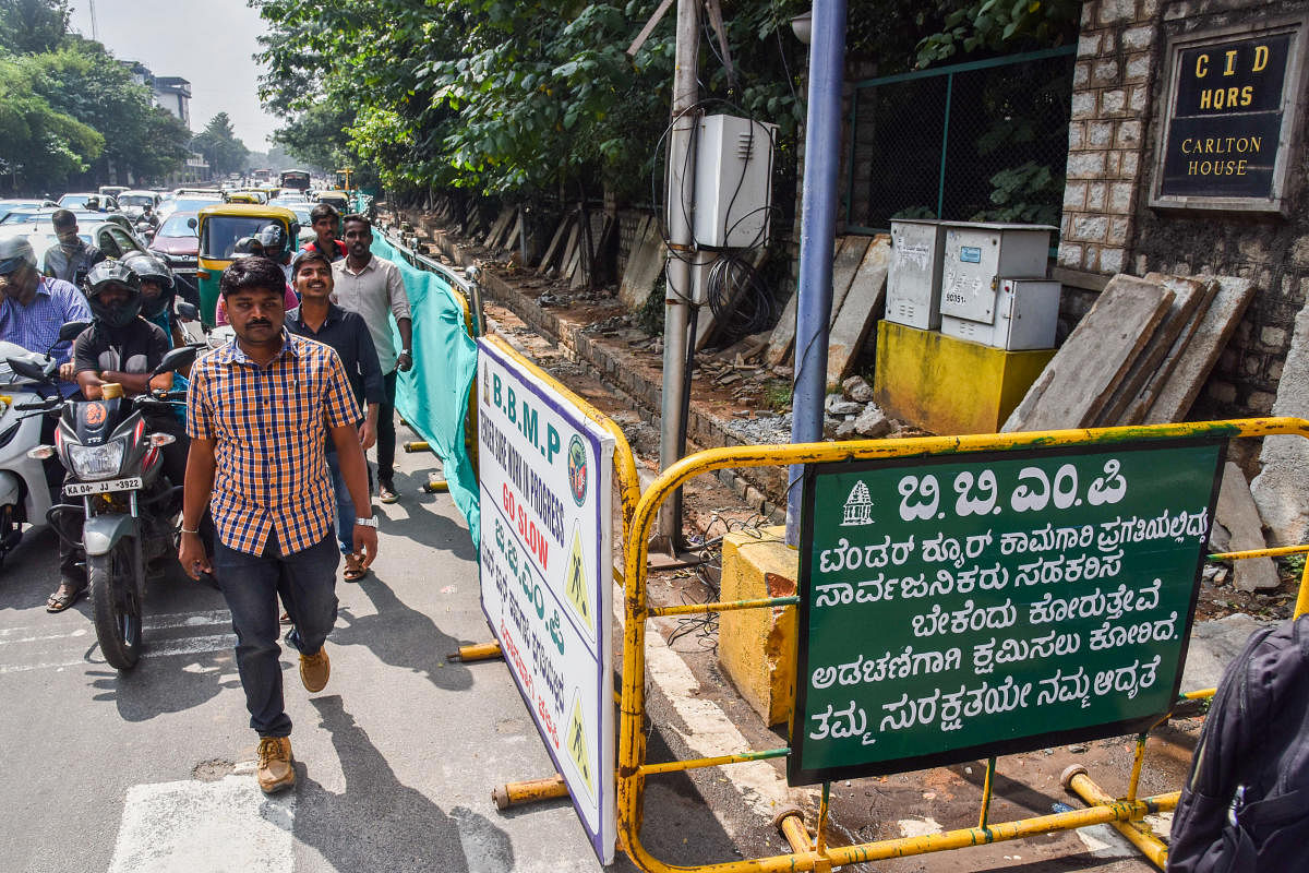 Pedestrians suffer to walk, due to Tender SURE work is started at Place Road, in front of CID Head Quarters in Bengaluru. Photo by S K Dinesh