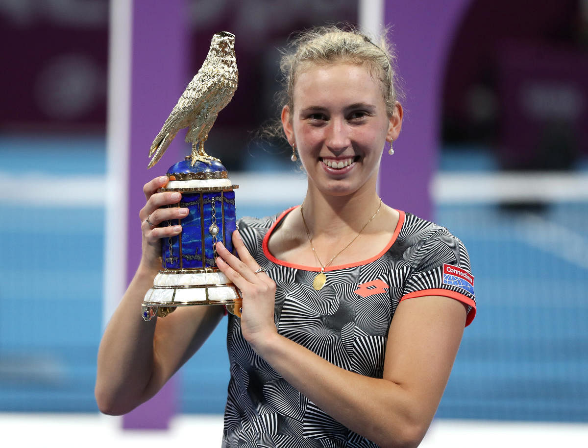 Belgium's Elise Mertens poses with the Qatar Open trophy after beating Simona Halep in the final on Saturday. REUTERS