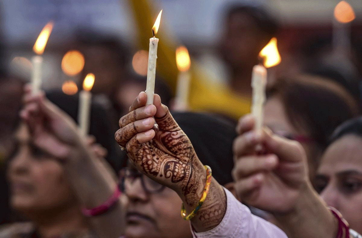 The School for the Deaf and Mute Society's staff and students take part in a candle light march to pay tribute to CRPF soldiers who lost their lives in Pulwama terror attack, in Ahmedabad, Sunday, Feb 17, 2019. (PTI Photo)