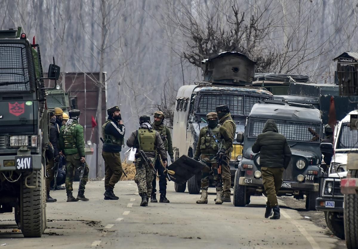 Security forces personnel arrive for the reinforcement during a gunbattle with the militants in which the top commander of the Jaish and Lethpora attack mastermind Kamran was killed along with his associate Hilal Ahmad, a local recruited by the terror group, at Pinglan area of Pulwama in south Kashmir, Monday, February 18, 2019. Four Army personnel, including a Major, were also martyred in the encounter. (PTI Photo)