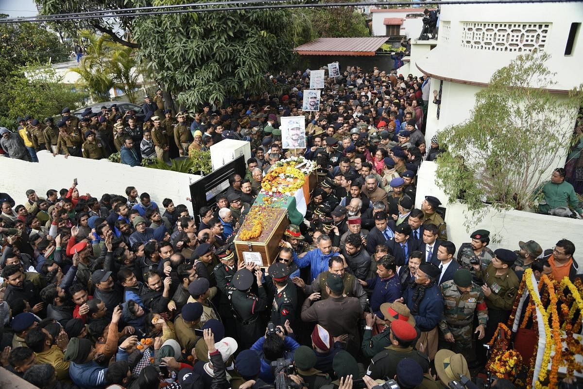 Army personnel and people gather around the mortal remains of Major Vibhuti Shankar Dhoundiyal, who lost his life in Pulwama encounter with Jaish-e-Mohammed (JeM) terrorists, to pay their last respects to him ahead of his funeral, in Dehradun. PTI file photo.