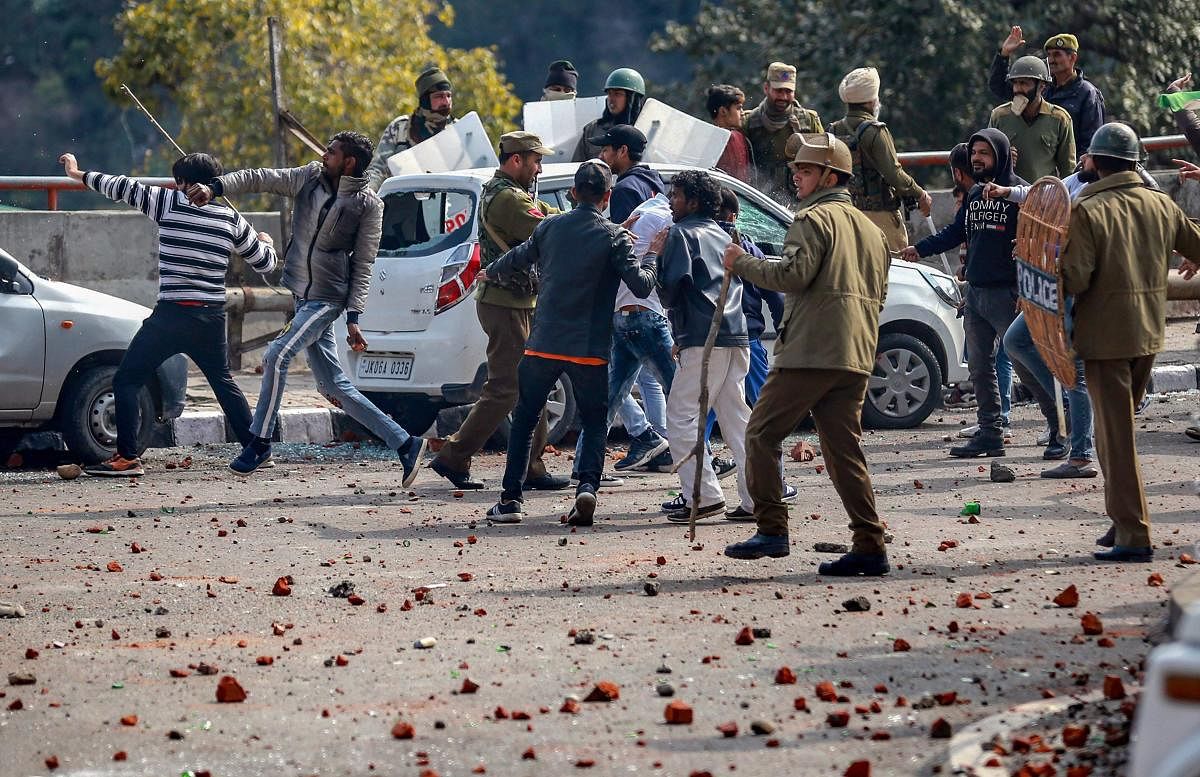 Protestors clash with police during a shutdown against the killing of CRPF personnel in the Pulwama terror attack, in Jammu. PTI