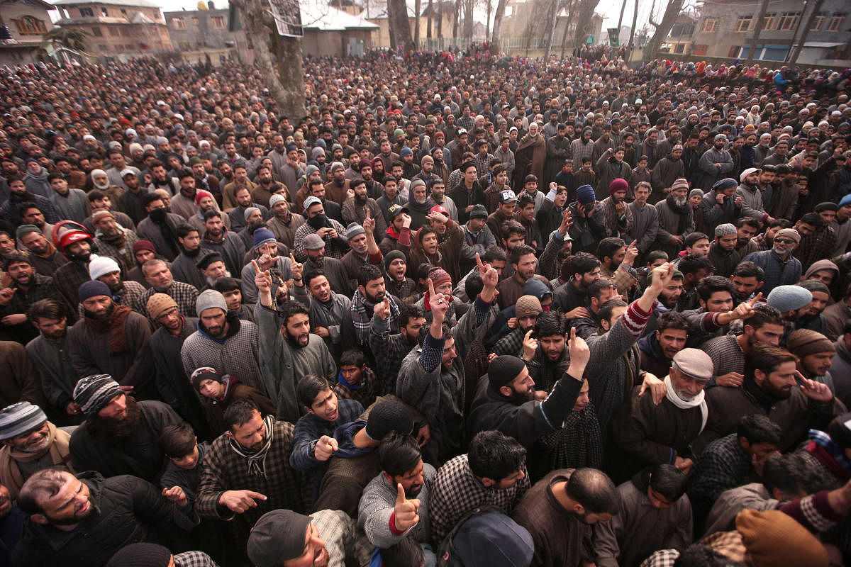 People shout slogans before offering funeral prayers of Mushtaq Ahmad, a civilian, and Hilal Ahmad Naikoo, a suspected militant, who according to local media were killed during a gun battle between suspected militants and Indian security forces on Monday, in Pinglena village in south Kashmir's Pulwama district February 19, 2019. (REUTERS)